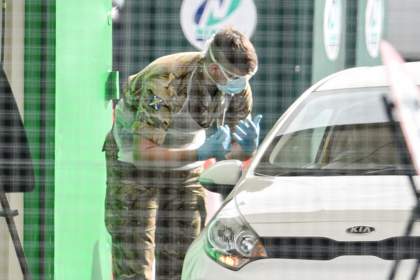 Masked military asking questions at car park