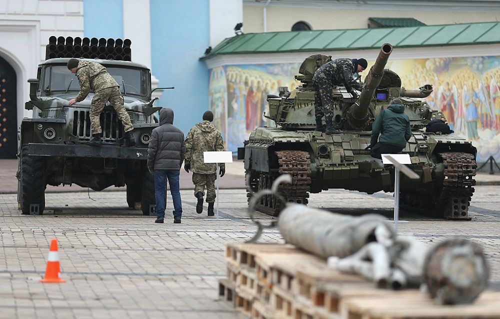 Security forces inspect a rocket launcher truck and a heavy tank that are part of an exhibition the Ukrainian government claims proves Russian direct involvement in the fighting between Ukrainian troops and pro-Russian separatists in eastern Ukraine prior to a visit to the exhibition by Ukrainian President Petro Poroshenko on February 22, 2015 in Kiev, Ukraine.