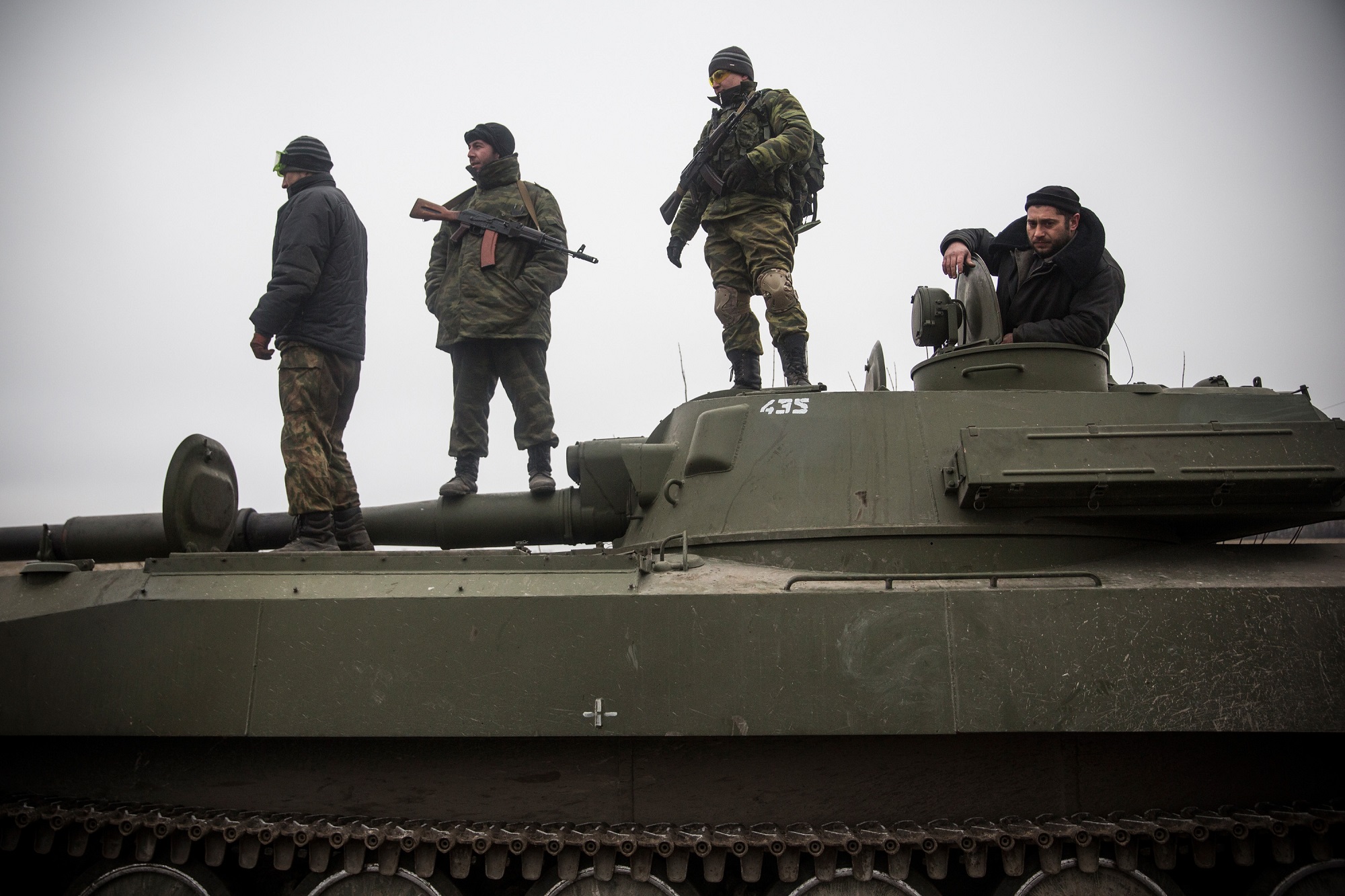 A photograph of Pro-Russian rebels allegedly move tanks and heavy weaponry away from the front line of fighting.