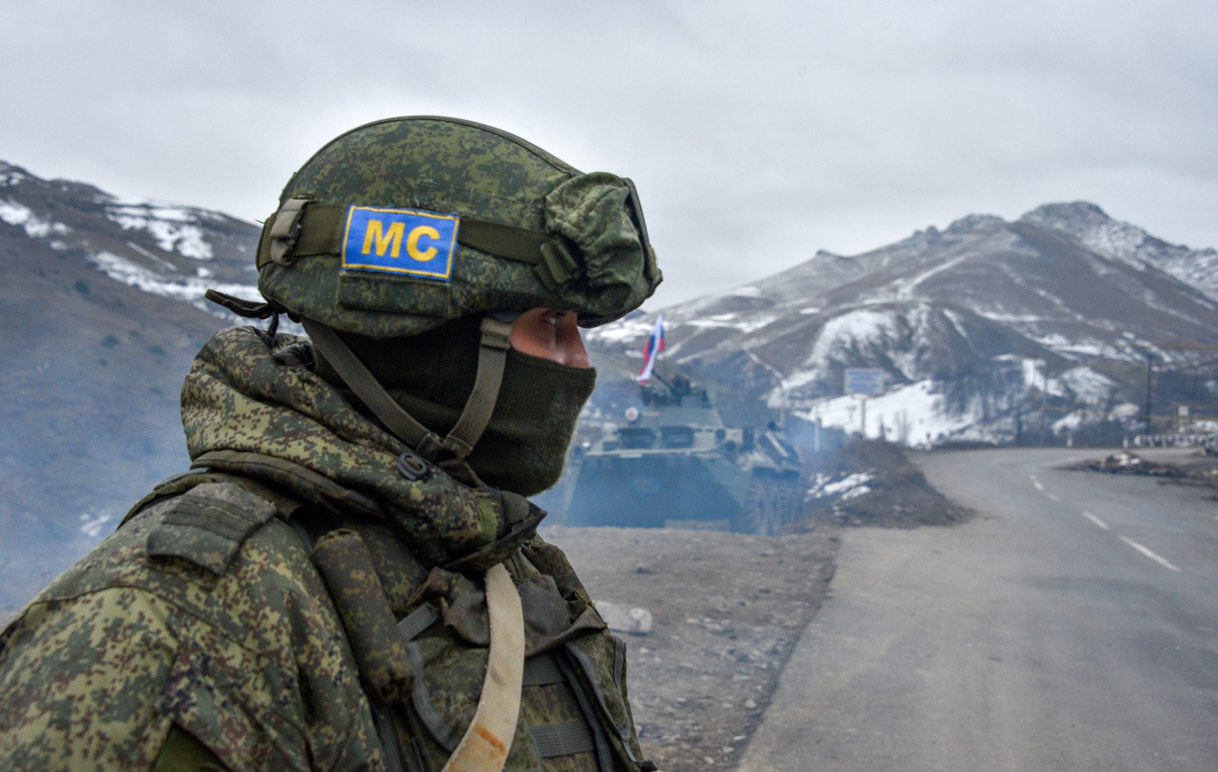 Russian soldiers of the peacekeeping force man a checkpoint on a road outside the town of Stepanakert on November 26, 2020, after six weeks of fighting between Armenia and Azerbaijan over the disputed Nagorno-Karabakh region.