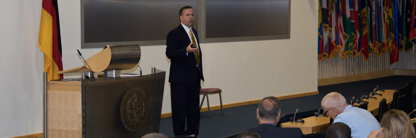 A photograph of Jonathan F. Odom speaking at a George C. Marshall Center event.