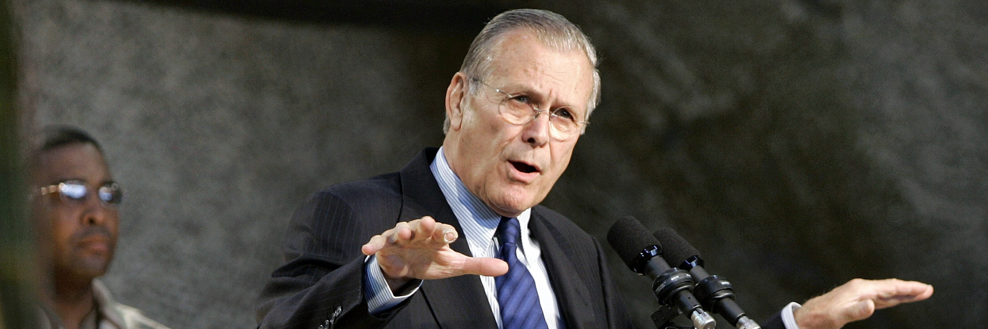 U.S. Secretary of Defense Donald Rumsfeld addresses U.S. military personnel before their scheduled departure to Iraq December 8, 2004 at Camp Buehring in Kuwait. Rumsfeld is on his way to India after attending the inauguration of Afghan President Hamid Karzai in Kabul. (Photo by Larry Downing-Pool/Getty Images)