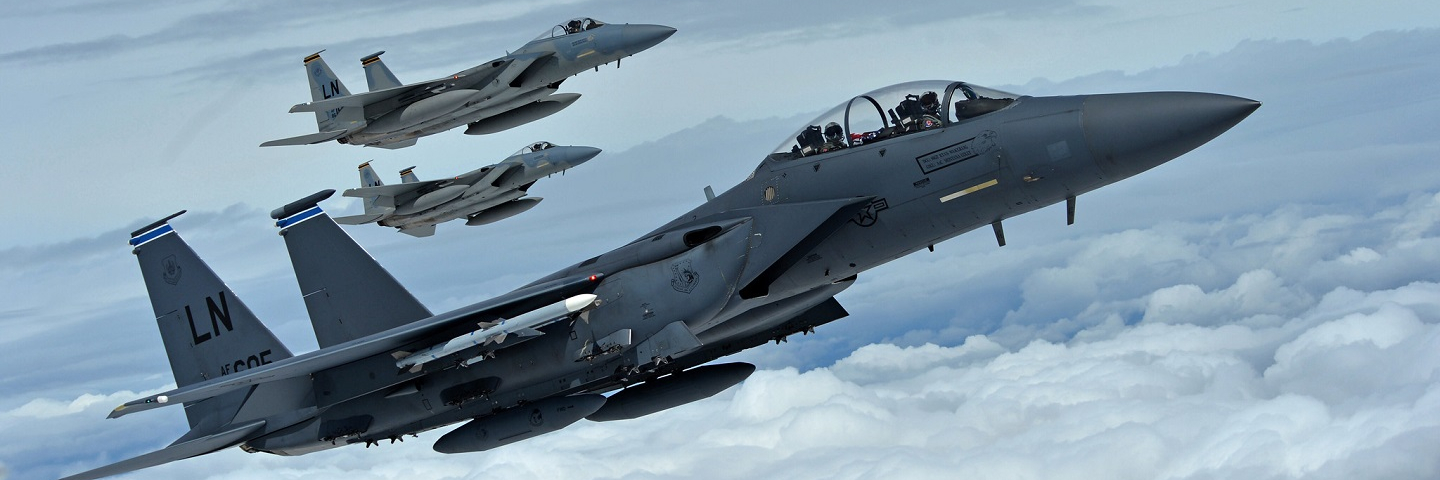 A formation of F-15C Eagles assigned to the 493rd Fighter Squadron, and an F-15E Strike Eagle assigned to the 492nd Fighter Squadron, fly over Gloucestershire, England, to attend the upcoming Royal International Air Tattoo airshow held at RAF Fairford July 7, 2016.