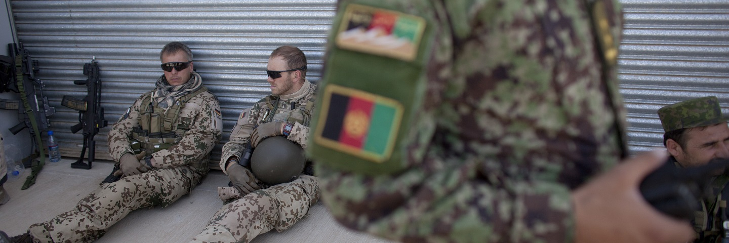 MAZAR-e-SHARIF, AFGHANISTAN - German soldiers attend a security transition ceremony July 23, 2011 in Mazar-e-Sharif, the provincial capital of Balkh province, Afghanistan.