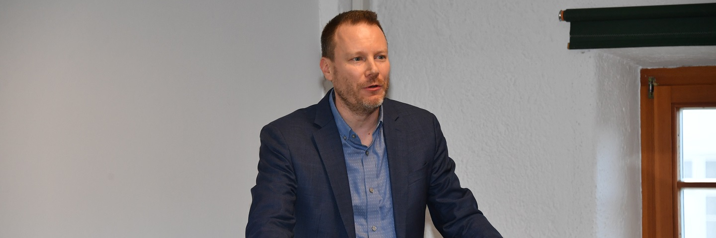 A photograph of professor Nickels speaking at a George C. Marshall Center brownbag event.