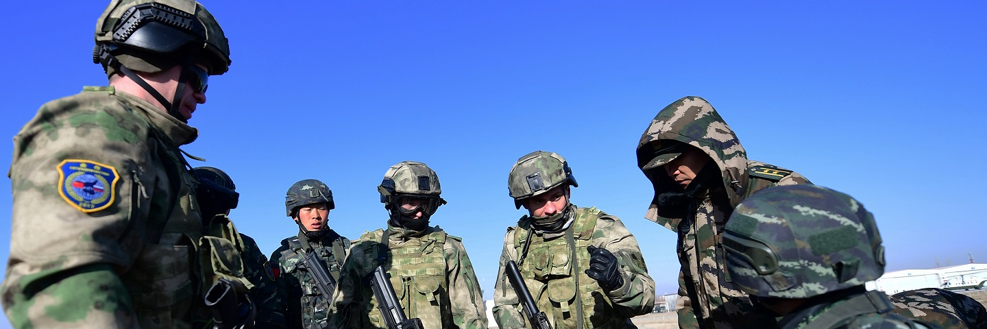 A photograph of soldiers in action during a drill on day three of the China-Russia counter-terrorist Cooperation.