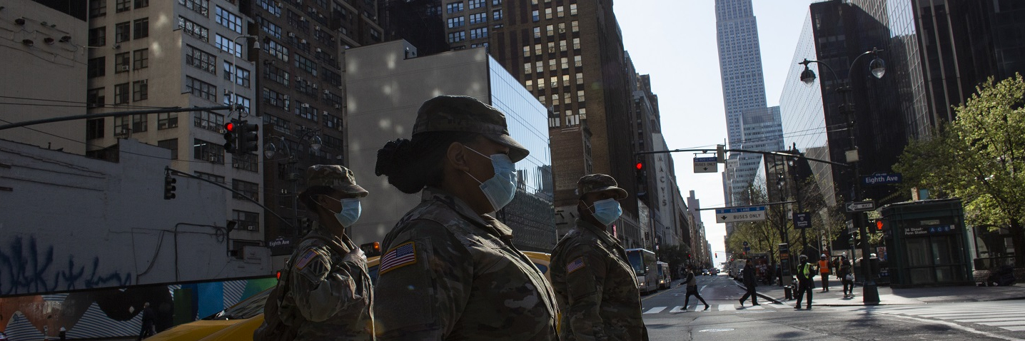 NEW YORK, NY - APRIL 06: U.S Army personnel wearing masks cross 34th street on April 6, 2020 in New York City. The COVID-19 death toll in the U.S. is approaching 10,000.