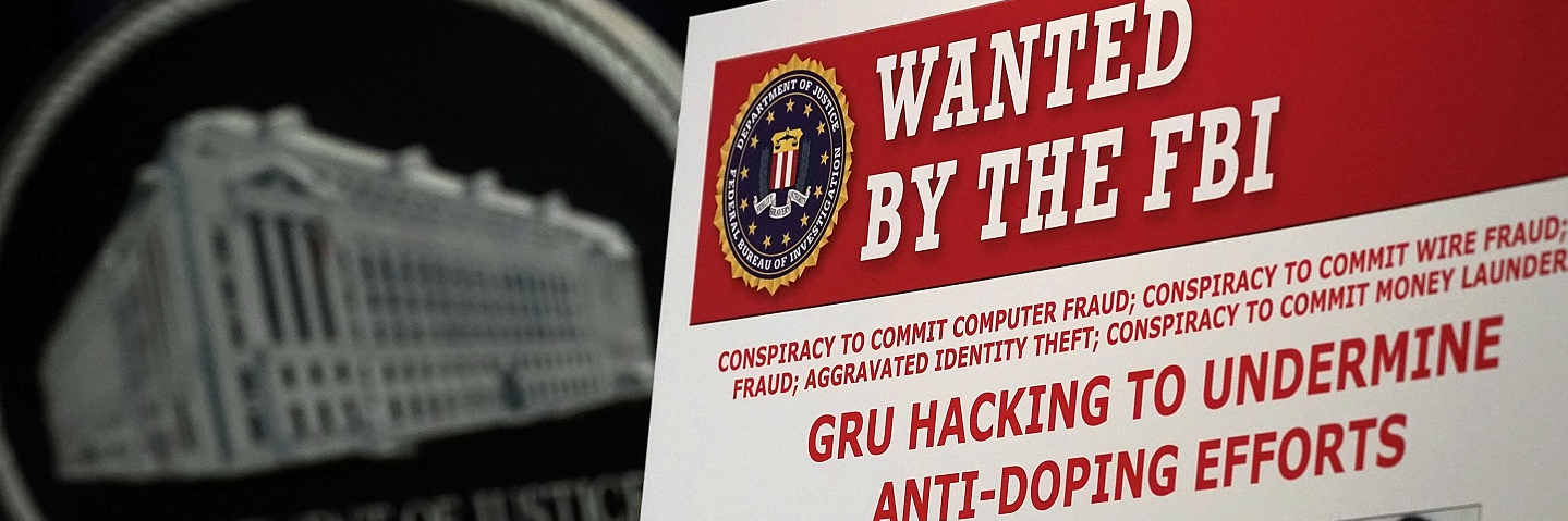 A "WANTED" poster of Russian individuals is seen during a news conference to announce criminal charges October 4, 2018 in Washington, DC.