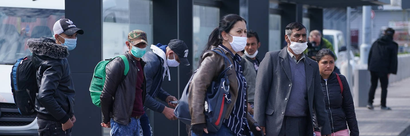 Seasonal workers from Romania board wait to board buses after arriving on a chartered flight at Schoenefeld Airport during the coronavirus crisis on April 09, 2020 in Schoenefeld, Germany.