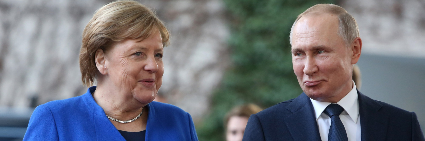 A photograph of German Chancellor Angela Merkel (CDU, L) greets Russian President Vladimir Putin as he arrives for an international summit on securing peace in Libya at the German federal Chancellery on January 19, 2020 in Berlin, Germany. Leaders of nations and organizations linked to the current conflict are meeting to discuss measures towards reaching a consensus between the warring sides and ending hostilities.