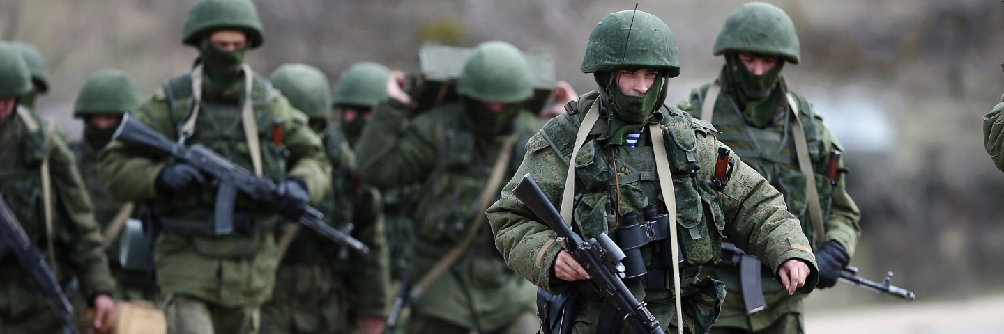 Russian military personnel move towards a Ukrainian military base on March 19, 2014 in Perevalnoe, Ukraine. Russia's Constitutional Court ruled unanimously on March 19 that Russia's President Vladimir Putin acted legally by signing a treaty to make Crimea part of Russia.