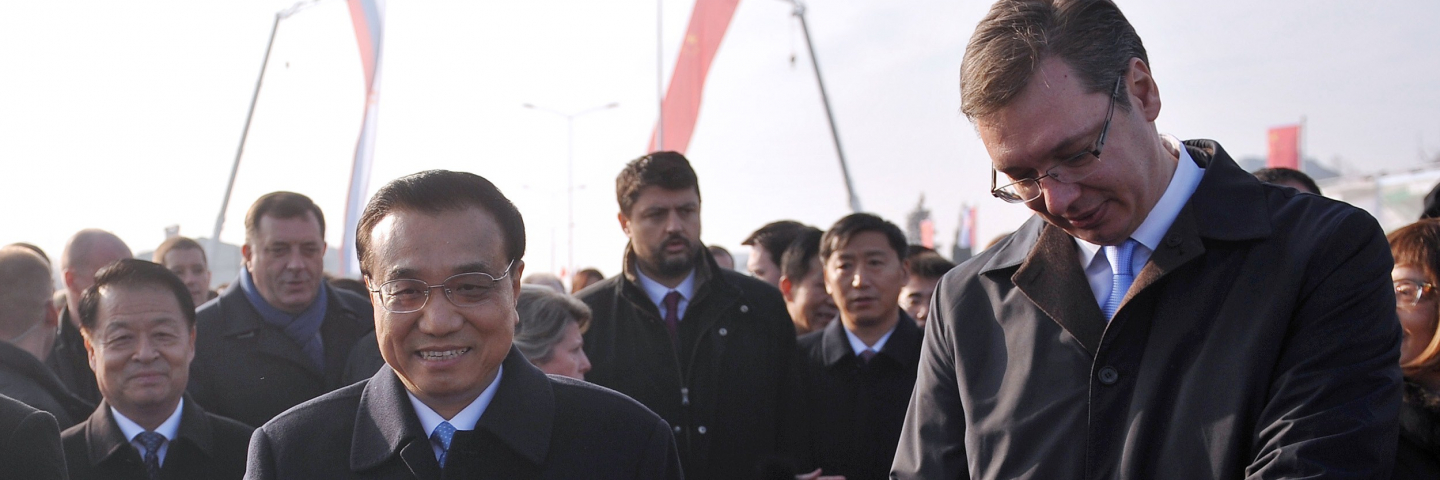 Chinese Prime Minister Li Keqiang (L) and his Serbian counterpart Aleksandar Vucic (R) cut a ribbon during an opening ceremony of Europe's first Chinese-built project near Belgrade on December 18, 2014.