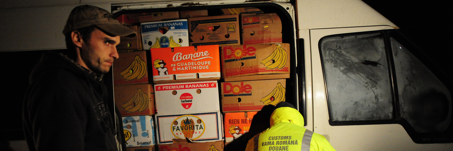 A Romanian customs officer searches a van for smuggled products, like cigarettes and alcohol, on the road to the city of Iasi, 400 kms northeast of Bucharest, on February 5, 2010. On the eastern border of the European Union, the fight against contraband cigarettes from Ukraine, Moldova and Russia, as well as member states like Poland, Romania, Hungary and Slovakia, is intensifying as price hikes in western European countries have made trafficking even more lucrative.