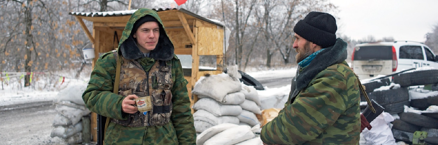 Members of the pro-Russian 1st Cossack Regiment guard a checkpoint.