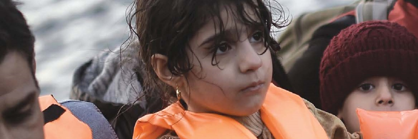 refugees with life vests in a boat
