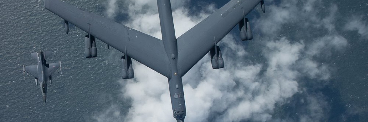 Airplane flying above clouds