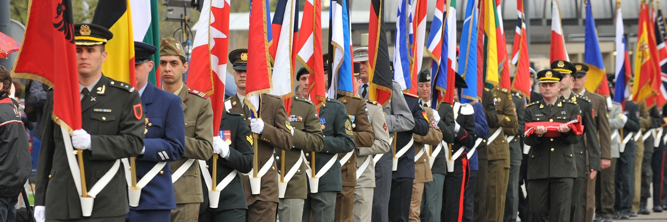SHAPE Honour Guard marches at the NATO ceremony for accession of Croatia and Albania.