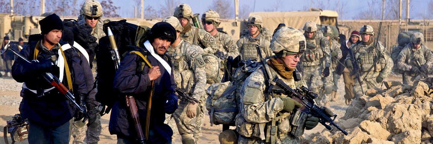 U.S. soldiers and Afghan police move out on a foot patrol in the Isa Khan region of Afghanistan's northern Kunduz province, Dec. 28, 2010.