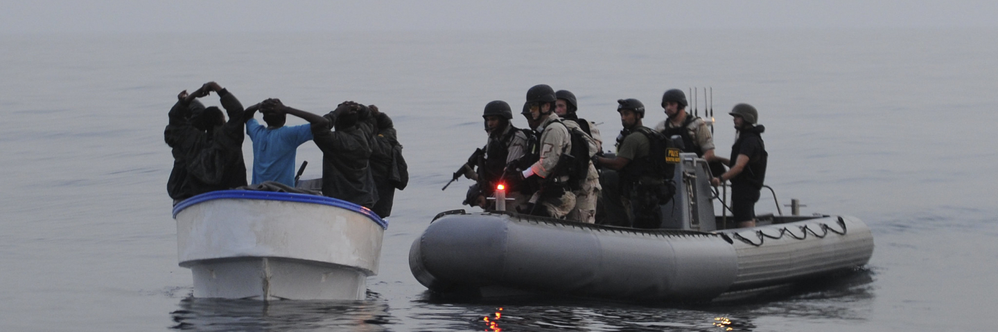 navy arresting pirates