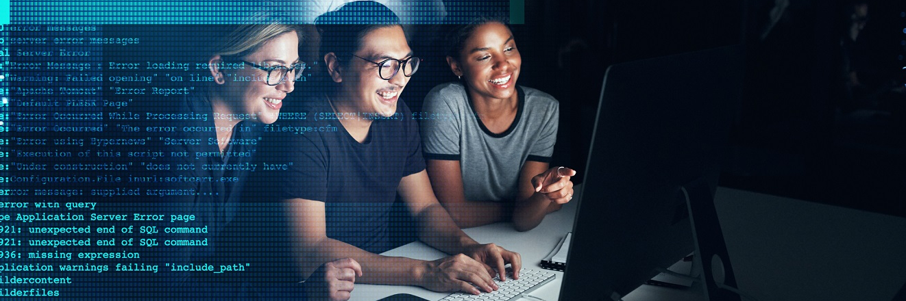 Shot of a group of programmers working together on a computer code at night.