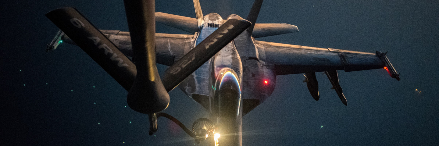 A U.S. Navy F/A-18E Super Hornet is refueled over the U.S. Central Command area of responsibility by a U.S. Air Force KC-135 Stratotanker, Sept. 22, 2020. The KC-135 delivers a global-reach aerial capability to support joint and coalition aircraft, and provide war-winning airpower throughout the USCENTCOM area of responsibility.
