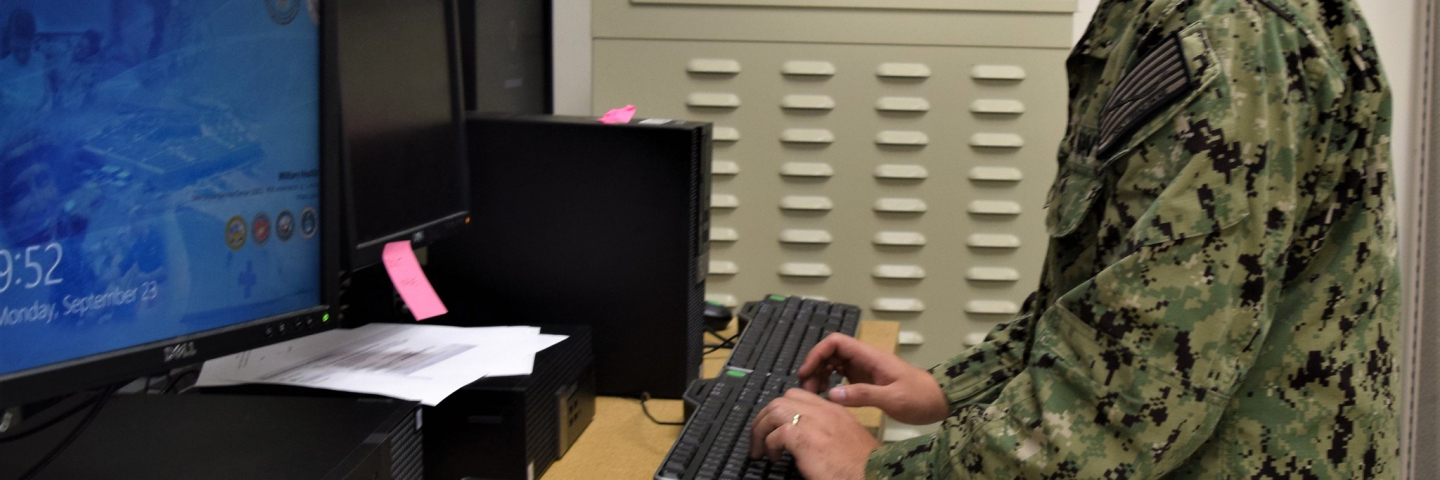 soldier at work on computer