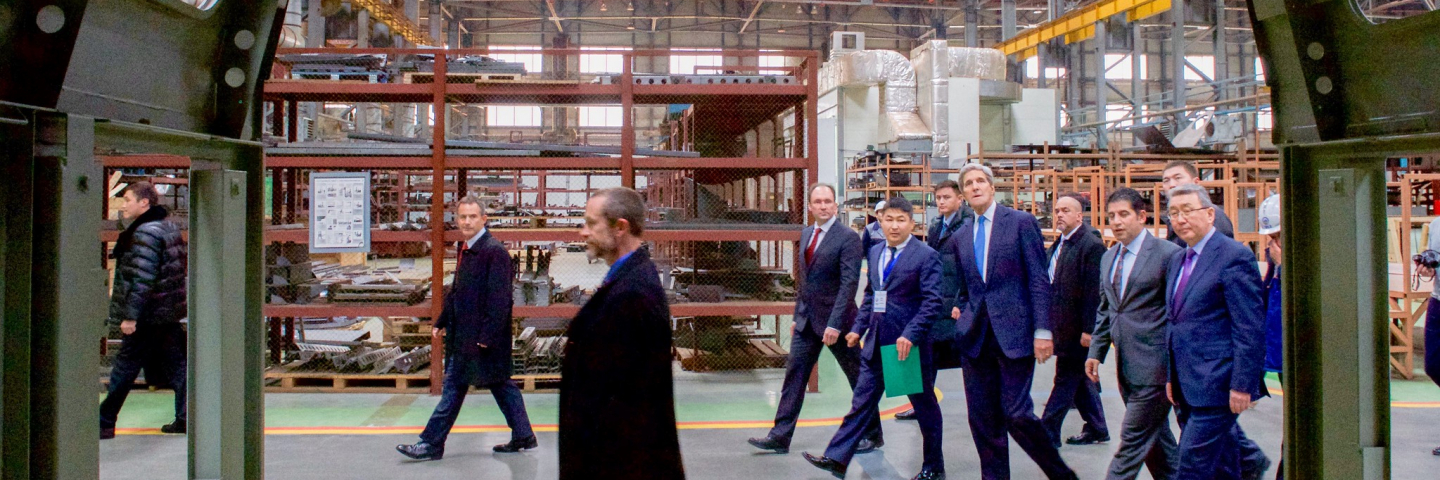 U.S. Secretary of State John Kerry looks at a finished locomotive cab during his tour of the Locomotive Plant in Astana, Kazakhstan