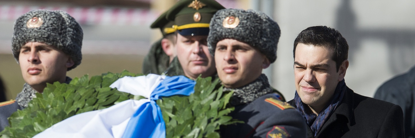 Russian soldier and Greek Prime Minister Alexis Tsipras take part in a wreath-laying ceremony at the Tomb of the Unknown Soldier by the Kremlin Wall in Moscow.