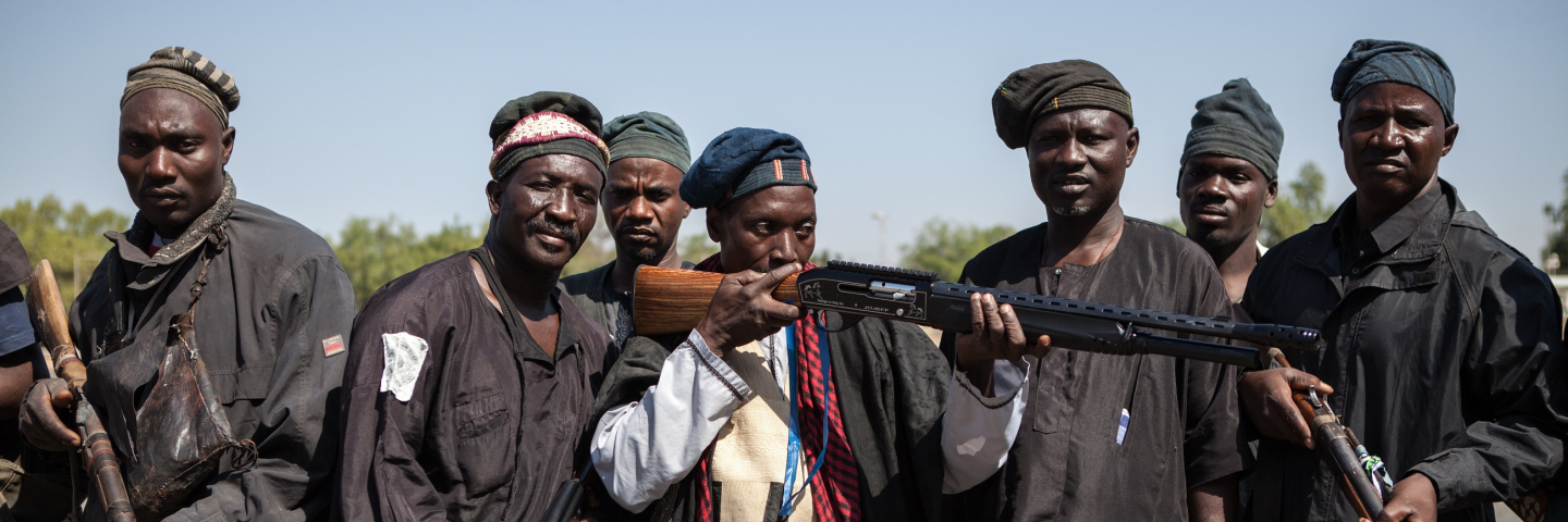 A band of hunters pose in Yola, state capital of Adamawa, on December 4, 2014 after taking part in an operation against Nigerian Islamist extremist group Boko Haram. Military and vigilantes forces acknowledge the crucial support of hunters in the fight against Boko Haram.