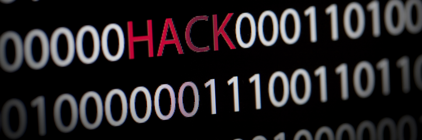 Hacking graphic with zeros and ones with the work HACK in the center.