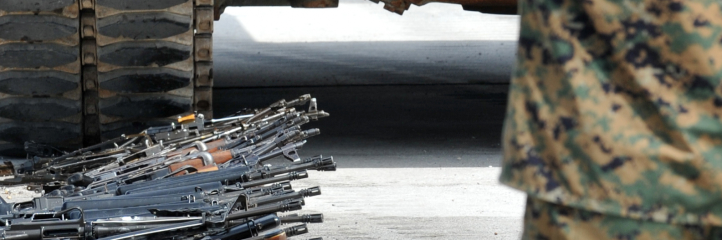 Bosnian Armed Force tank T-60 is lined up to crush the first of a batch of small arms