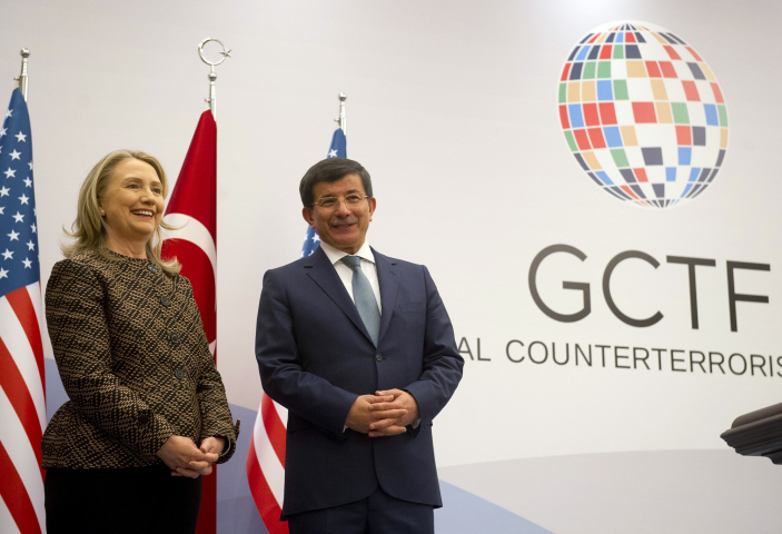 Turkish Foreign Minister Ahmet Davutoglu and US Secretary of State Hillary Clinton pose before a press conference at the Global Counterterrorism Forum in Istanbul on June 7, 2012