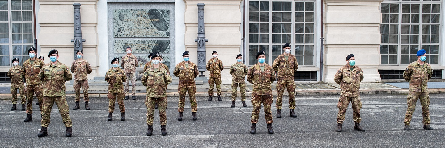 A line up of Italian army nurses wearing a protective mask during the presentation of the army team who will participate in the Piedmont hospitals in the fight against the virus, in Turin, Italy, on April 27, 2020. 