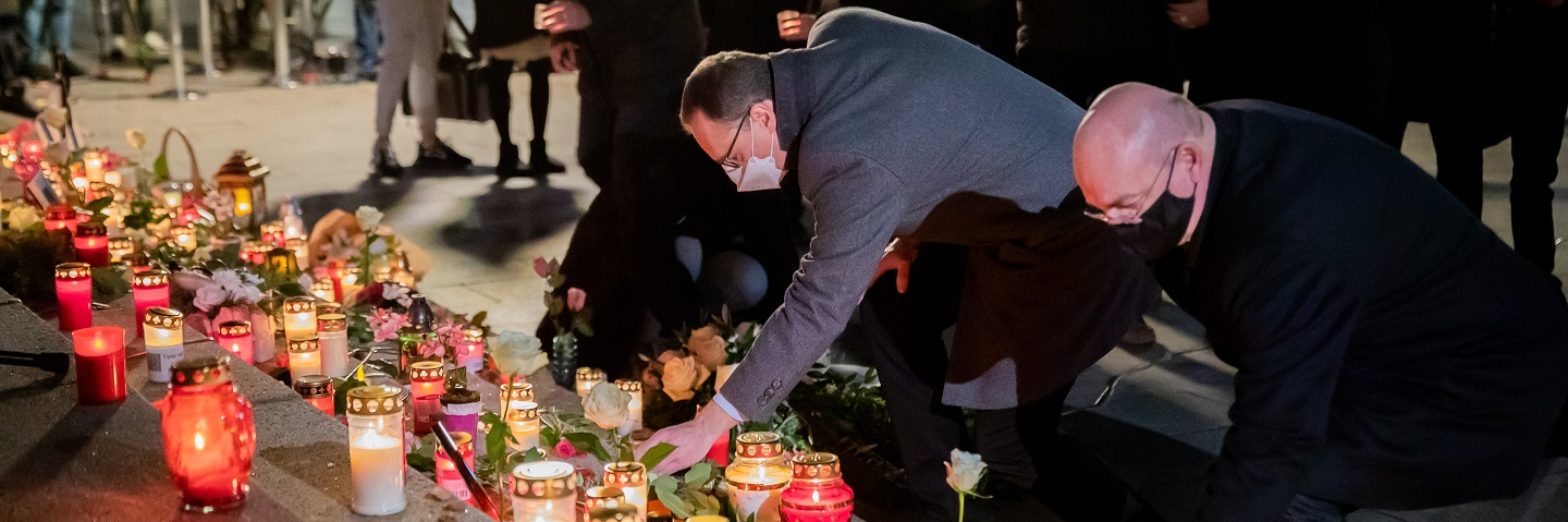 Michael Müller, Governing Mayor of Berlin, and Edgar Franke, Victims' Commissioner of the German government, lay candles during a memorial service on the fourth anniversary of the Islamist attack on the Christmas market at Breitscheidplatz.