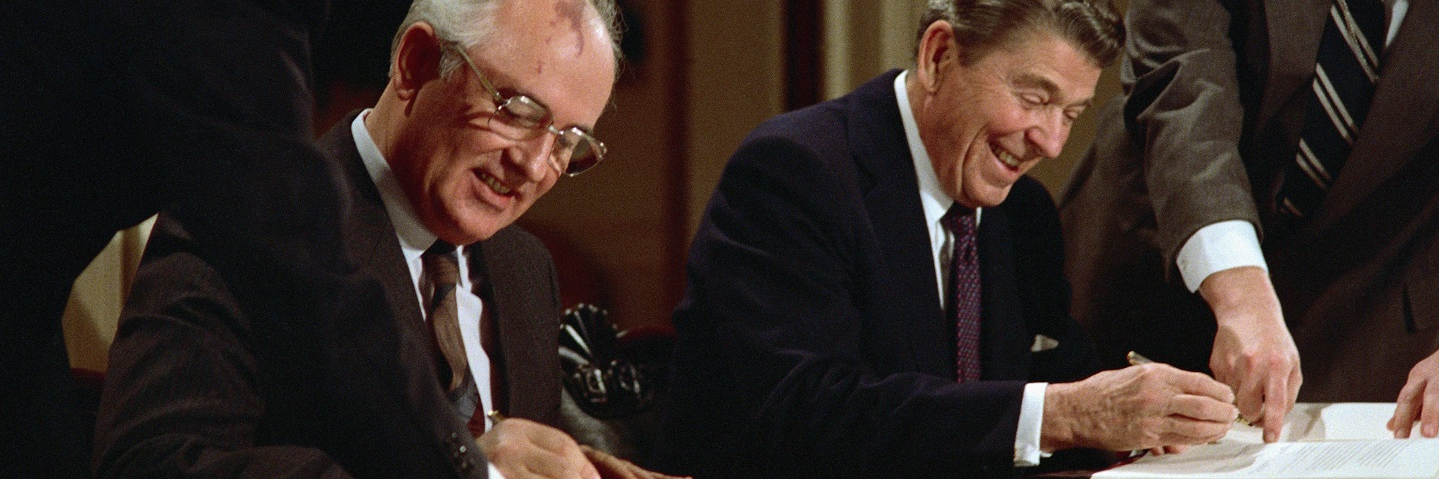 US President Ronald Reagan and Soviet leader Mikhail Gorbachev signing the arms control agreement banning the use of intermediate-range nuclear missiles, the Intermediate Nuclear Forces Reduction Treaty, Washington DC, 8th December 1987.
