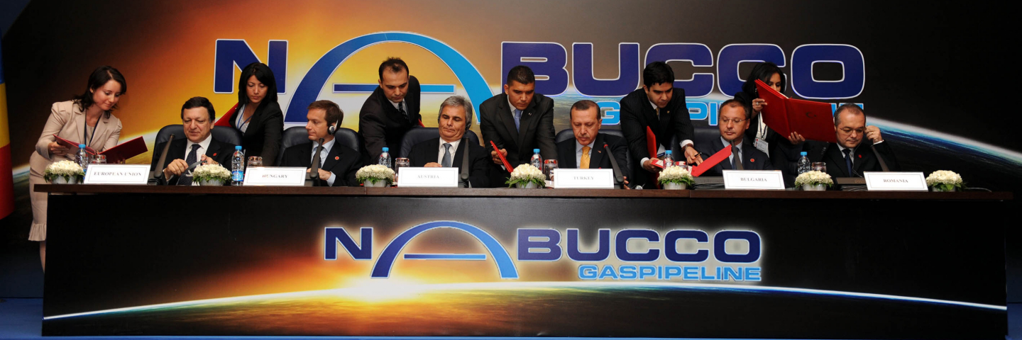 Turkey's Prime Minister Recep Tayyip Erdogan (3rd R) talks during the signing ceremony of the Nabucco Intergovernmental Agreement in Ankara on July 13, 2009. Erdogan said on Monday Turkey wanted Iranian gas to be transported to Europe via the planned Nabucco pipeline "when conditions allow", despite U.S. opposition.