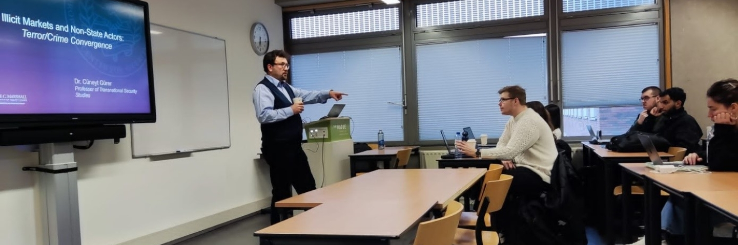 Dr. Cüneyt Gürer delivers a lecture on transnational threats at The Hague University of Applied Sciences.