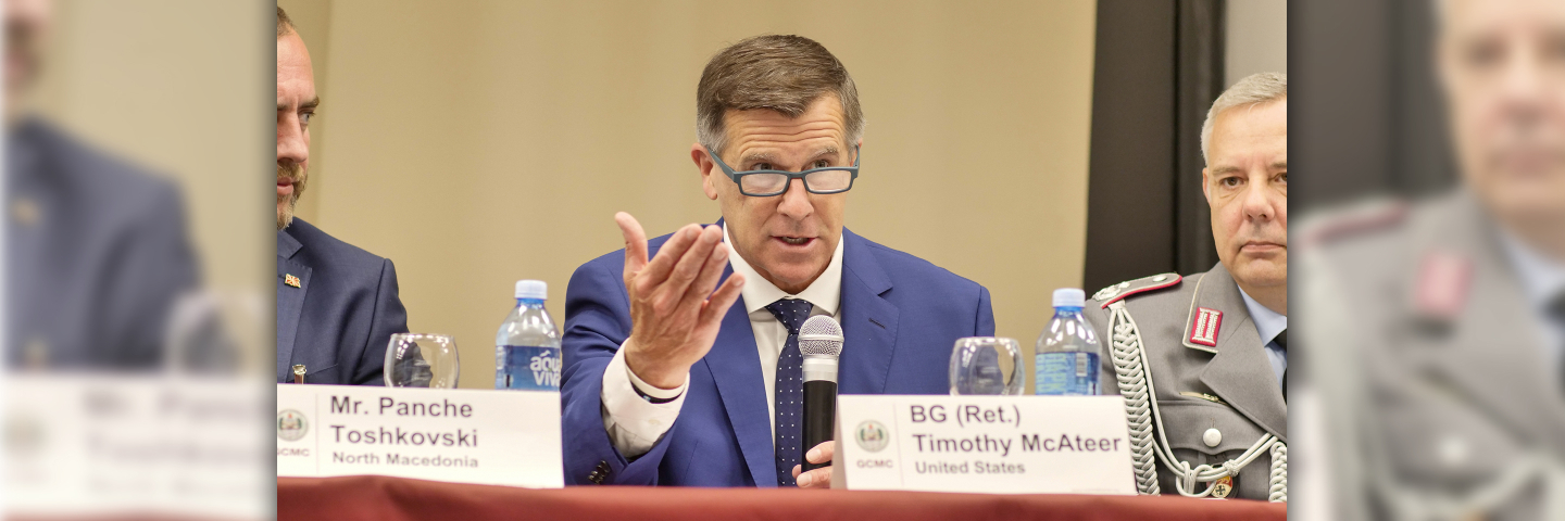 Marshall Center Deputy Director Tim McAteer speaks into a microphone during a panel at the 2024 Ohrid Regional Security Alumni Forum, the predecessor to the Western Balkans Forum.”