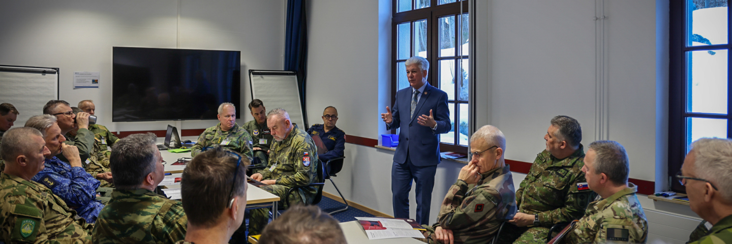 Man presents to uniformed military