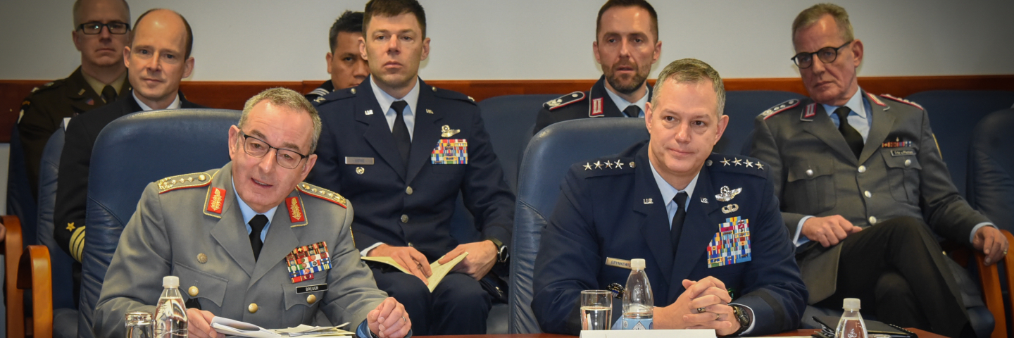 German Chief of Defence Gen. Carsten Breuer and U.S. Air Force Gen. Alexus Grynkewich sit at a conference table during a roundtable discussion at the Marshall Center, joined by senior military officers from Germany and the United States seated behind them.