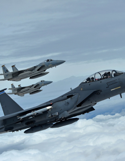 A formation of F-15C Eagles assigned to the 493rd Fighter Squadron, and an F-15E Strike Eagle assigned to the 492nd Fighter Squadron, fly over Gloucestershire, England, to attend the upcoming Royal International Air Tattoo airshow held at RAF Fairford July 7, 2016.