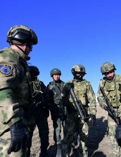 A photograph of soldiers in action during a drill on day three of the China-Russia counter-terrorist Cooperation.