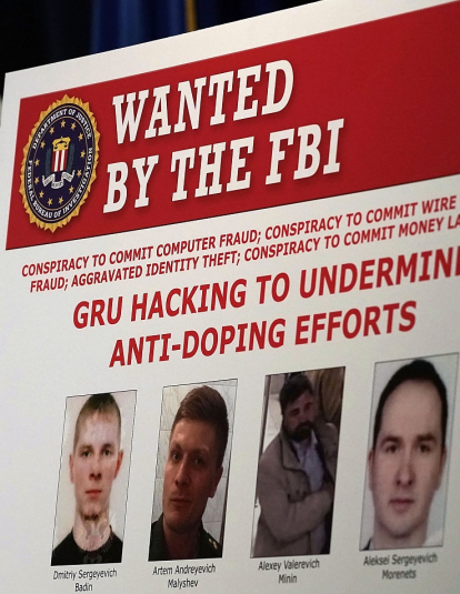 A "WANTED" poster of Russian individuals is seen during a news conference to announce criminal charges October 4, 2018 in Washington, DC. 