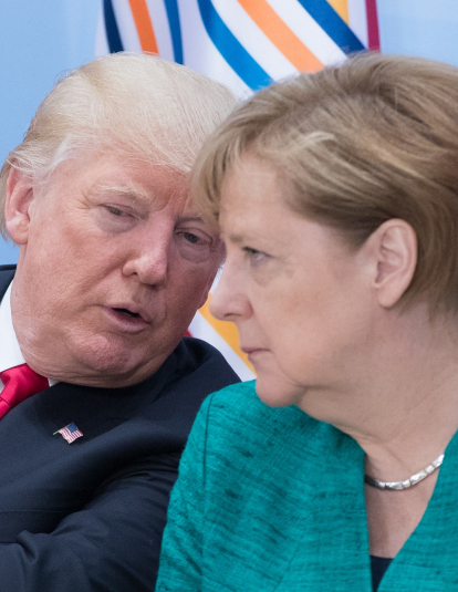 A photograph of German Chancellor Angela Merkel (R) and US President Donald Trump attend a panel discussion titled 'Launch Event Women's Entrepreneur Finance Initiative' on the second day of the G20 summit on July 8, 2017 in Hamburg, Germany.