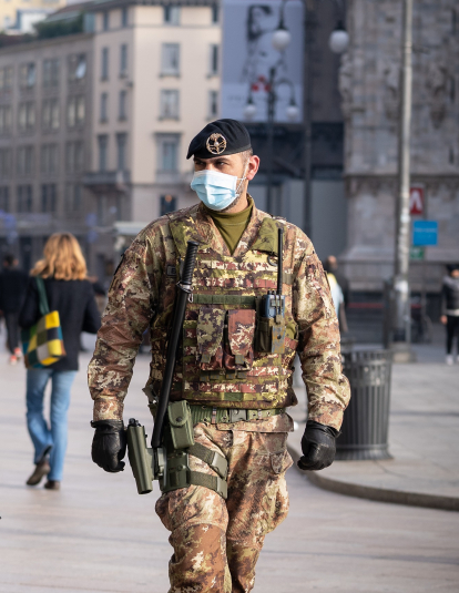 Two soldiers wearing face masks patrol Duomo Square in Milan, Italy on December 14, 2020. Since December 13, no region in Italy is in total lockdown anymore (red zone), however, given the high number of people seen on the streets in the very first days, the government is already thinking of re-imposing strict measures for the Christmas holidays in order to avoid a third wave of coronavirus (Covid-19) pandemic. 
