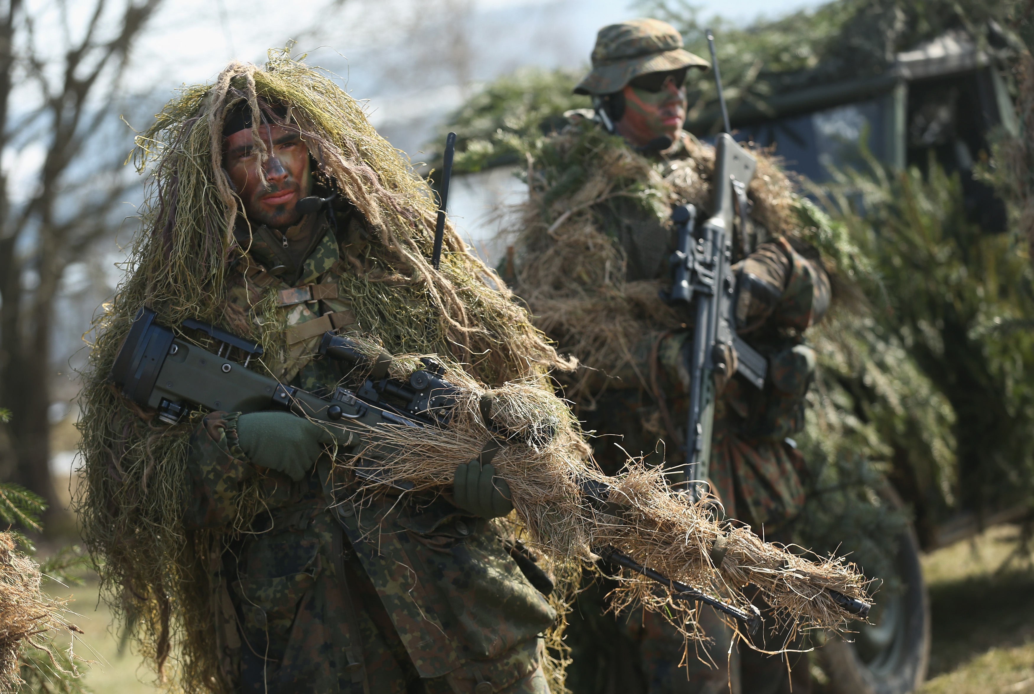 MARIENBERG, GERMANY - MARCH 10: Members of the German Bundeswehr's 371st Armoured Infantry Battalion (Panzergredanadierbataillon 371) stand in camouflage with sniper rifles during a media event at the battalion's base on March 10, 2015 in Marienberg, Germany. 