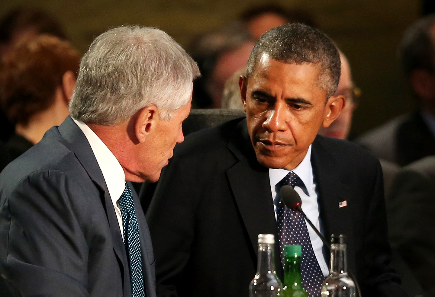 President Barack Obama (R) listens to Defence Secretary Chuck Hagel at the NATO Summit on September 5, 2014 in Newport, Wales. Leaders and senior ministers from around 60 countries are meeting on the final day of the two day summit, with Afghanistan and Ukraine at the top of the agenda.