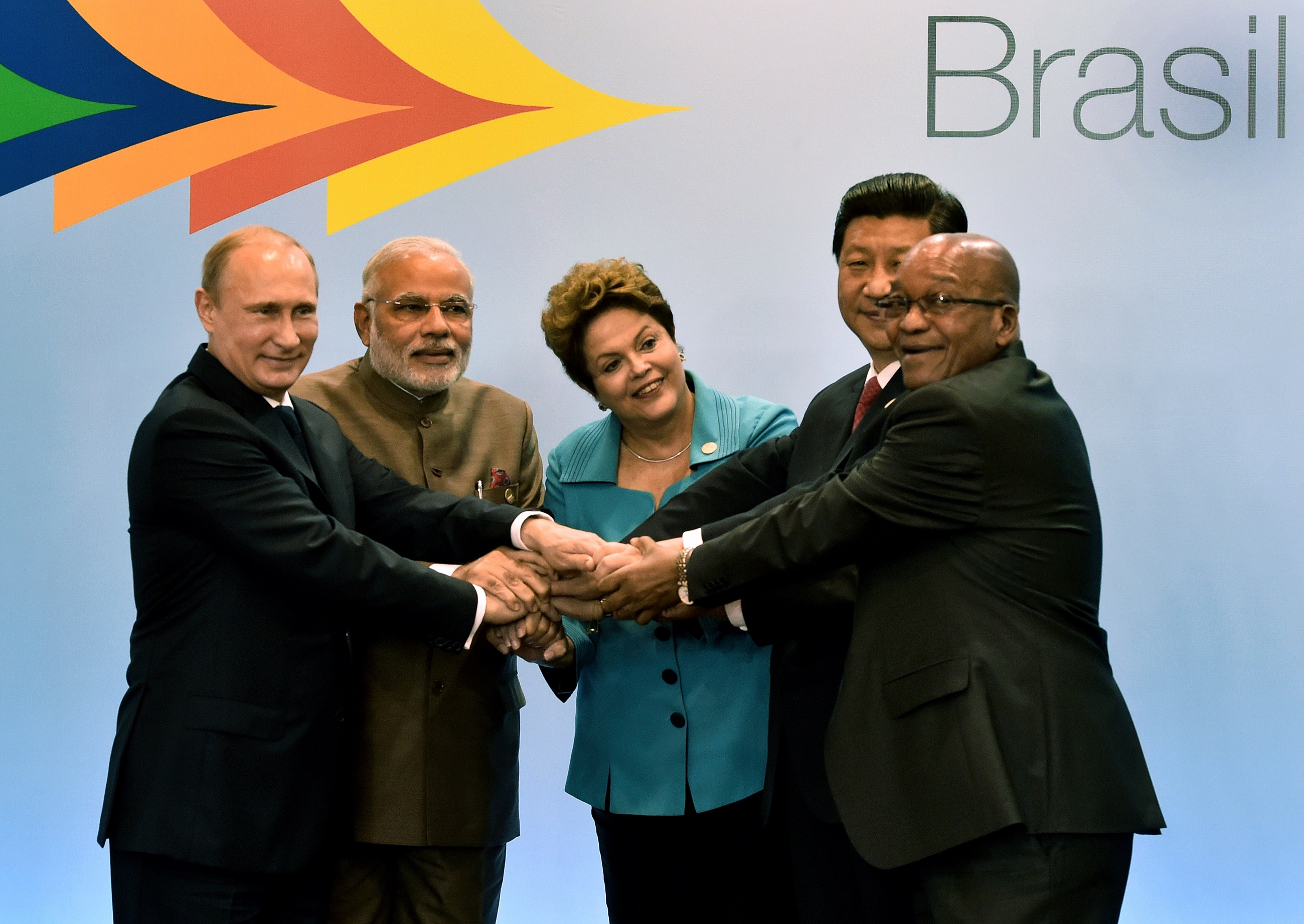 Photograph of the following representatives shaking hands Russian President Vladimir Putin, India's PM Narendra Modi, Brazilian President Dilma Rousseff, China's President Xi Jinping and South Africa's Jacob Zuma gesture during the 6th BRICS Summit in Fortaleza, Brazil, on July 15, 2014