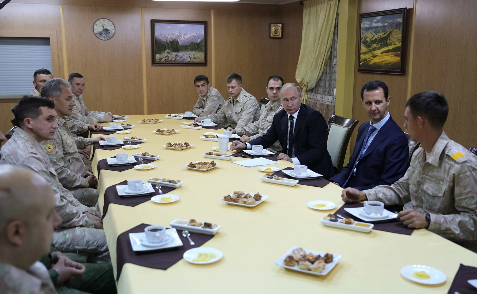 Russian President Vladimir Putin (3rd R) and President of Syria Bashar Al-Assad (2nd R) hold a meeting at Khmeimim Air Base in Latakia, Syria on December 11, 2017.