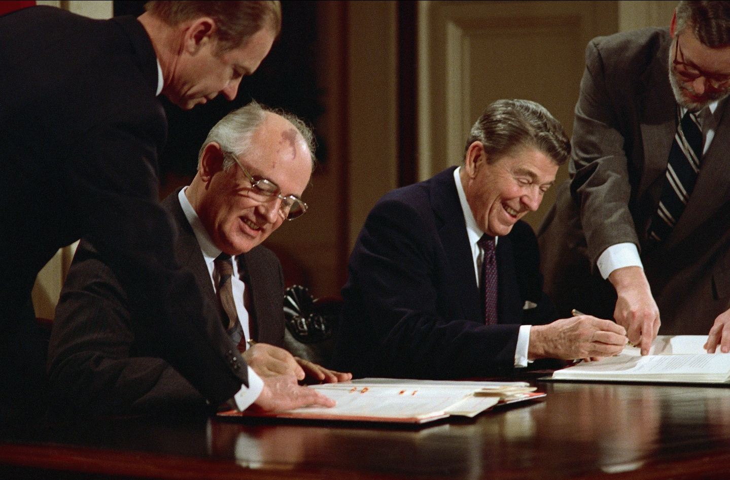 US President Ronald Reagan and Soviet leader Mikhail Gorbachev signing the arms control agreement banning the use of intermediate-range nuclear missiles, the Intermediate Nuclear Forces Reduction Treaty, Washington DC, 8th December 1987.